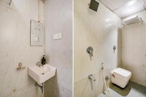 a bathroom with a sink and a toilet at FabExpress Embassy Suites in Mumbai