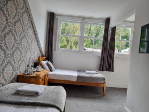Postel nebo postele na pokoji v ubytování Fellview Guest House