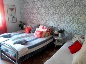 a bedroom with two beds with pillows on them at Willa Pasja in Inowrocław