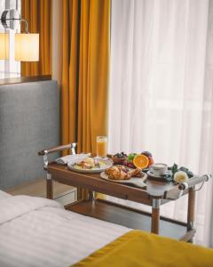 a tray of food on a table in a hotel room at Glarros OldTown in Tbilisi City