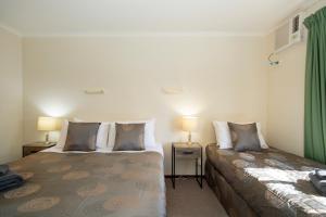 Ardrossan Hotel Motel客房内的一张或多张床位