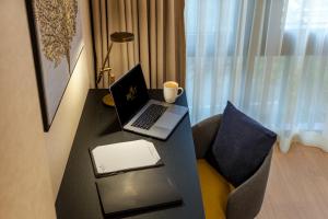 a laptop computer sitting on a desk in a room at Broyt Hotel in Istanbul