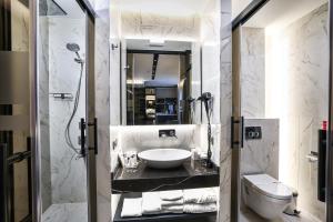 a bathroom with a sink and a toilet at Broyt Hotel in Istanbul