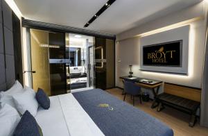 a hotel room with a bed and a desk at Broyt Hotel in Istanbul