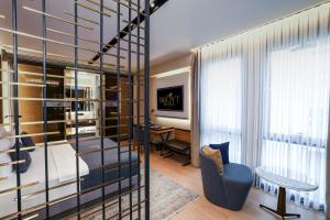 a hotel room with a bed and a desk and a chair at Broyt Hotel in Istanbul