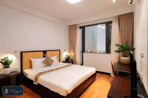 a bedroom with a bed and a large window at High-ser Apartment -2BR - NiceView - Parking - Spacious - In center in Hanoi
