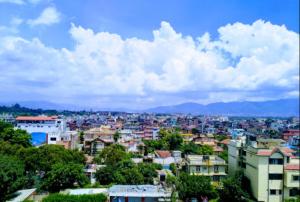 a view of a city with buildings and trees at Hotel Mirage Regency in Kathmandu