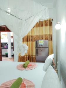 Postel nebo postele na pokoji v ubytování Bloom Guest House