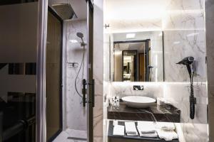 a bathroom with a sink and a shower at Broyt Hotel in Istanbul