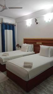 Postel nebo postele na pokoji v ubytování The Local Stay Maldives