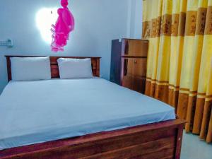 Postel nebo postele na pokoji v ubytování Bloom Guest House