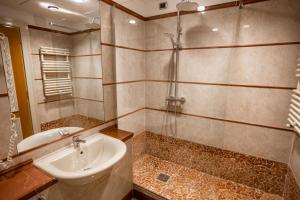 a bathroom with a sink and a shower at Papillo Hotels & Resorts Roma in Rome +20 photos