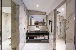 a bathroom with a sink and a toilet and a shower at Broyt Hotel in Istanbul