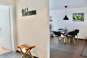 a dining room with a table and chairs at Apartment Arvenwald in Kandersteg