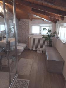 a bathroom with a sink and a toilet at B & B Ametista Bergamo in Ponteranica