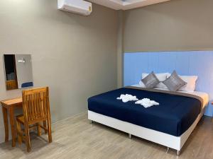 Ένα ή περισσότερα κρεβάτια σε δωμάτιο στο Greathill Gardenhome Resort Chomthong-Chiangmai