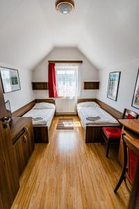 Postel nebo postele na pokoji v ubytování Penzion Černý Sklep