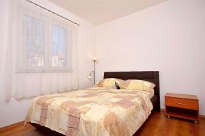 Postel nebo postele na pokoji v ubytování Apartment Srima