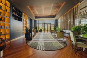 an office lobby with a rug on the floor at The Reserve - The Leading Hotels of the World - Savoy Signature in Funchal