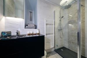 a bathroom with a sink and a glass shower at Clos Grimont in Poligny +39 photos