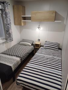 Mobil-home Camping Siblu La Reserve ****客房内的一张或多张床位