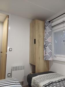 Mobil-home Camping Siblu La Reserve ****客房内的一张或多张床位