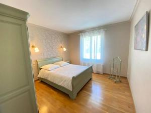 a bedroom with a bed and a window at Gite du Plessis in Saint-Onen-la-Chapelle