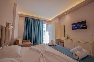 Postel nebo postele na pokoji v ubytování HOTEL DENOEL