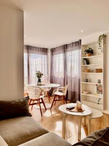 a living room with a couch and a table at PARAISO DEL SOL in Benajarafe +31 photos