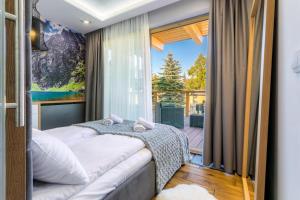 Postel nebo postele na pokoji v ubytování POD SKOCZNIA SPA Zakopane