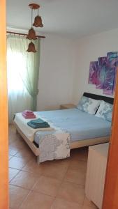 Giường trong phòng chung tại La villa al mare