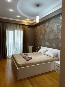 Ένα ή περισσότερα κρεβάτια σε δωμάτιο στο apartments in the new city 2