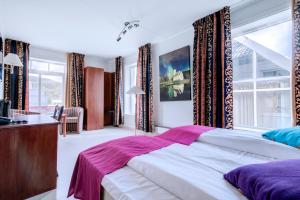 Postel nebo postele na pokoji v ubytování Melbu Hotell + 37 fotografií
