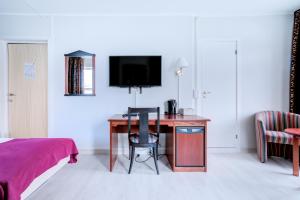 TV a/nebo společenská místnost v ubytování Melbu Hotell