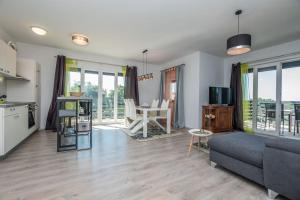 a living room with a couch and a table at Apartments Bella Vista in Nova Vas