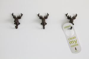 two reindeer earrings and a tag that reads clean my castle at Grimm's Potsdamer Platz in Berlin