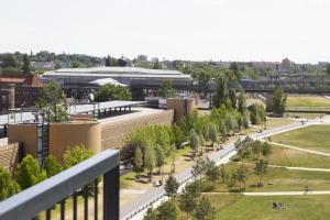 an aerial view of a campus with trees and buildings at Grimm's Potsdamer Platz in Berlin