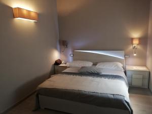 Postel nebo postele na pokoji v ubytování Hotel Monti