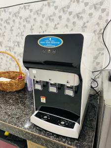 a coffee maker sitting on top of a counter at Homestay CikguMa - Netflix & Wifi in Kota Bharu