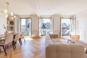 a living room with a couch and a table at Charming apartment in the heart of Paris with rooftop views in Paris