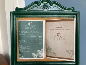 a picture of a menu in a frame on a wall at Suíte no Hotel Quitandinha Popular 39 in Petrópolis