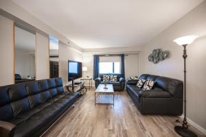 a living room with a couch and a table at Stay Together Suites on The Strip - 2 Bedroom Condo 926 in Las Vegas