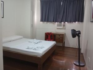 Ein Bett oder Betten in einem Zimmer der Unterkunft Citywalk Hotel