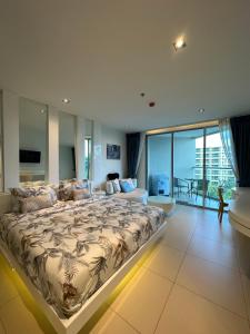 Postel nebo postele na pokoji v ubytování Sands Condominium Pattaya + 22 fotografií