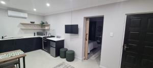 Kuchyň nebo kuchyňský kout v ubytování Uitsig Boutique Hotel