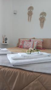two white towels sitting on top of a bed at Quinta das Reveladas in Marvão +42 photos