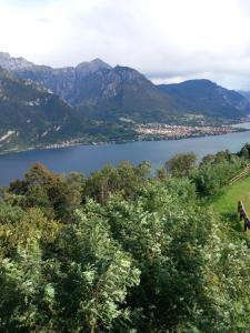 a view of a lake with mountains in the background at La casa di Tina - Civenna in Civenna