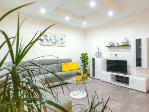 a living room with a couch and a table at House Antonia by IstriaLux in Svetvinčenat
