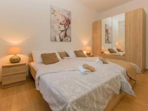 a bedroom with two beds with towels on them at House Antonia by IstriaLux in Svetvinčenat +25 photos