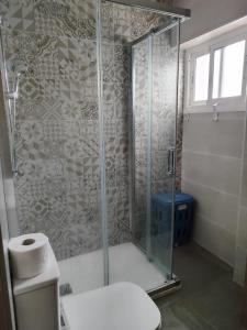 a shower stall in a bathroom with a toilet at San Francisco in Tarifa